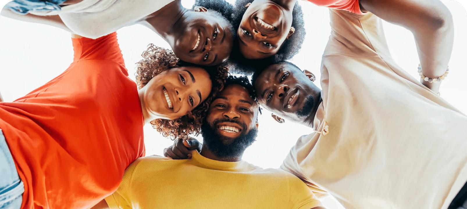 A circle of friends looking down at the camera