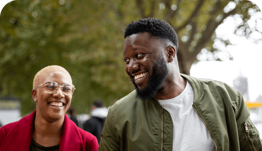 Two people talking outdoors